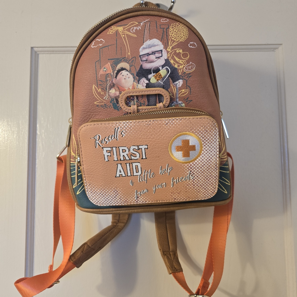 Danielle Nicole Tan Backpack with Pixar Tag